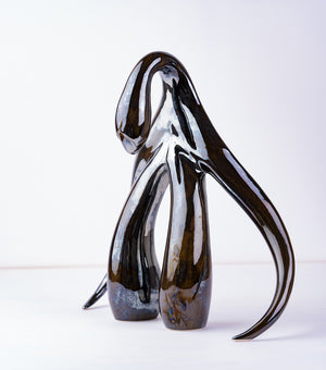 3/4 front view of swan series sculpture in black opal by Sophia Wallace.