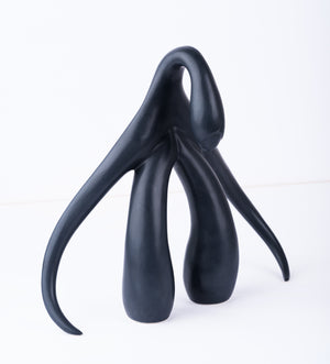 3/4 front view of "Swan Series" ceramic sculpture in matte black by Sophia Wallace, 2022.