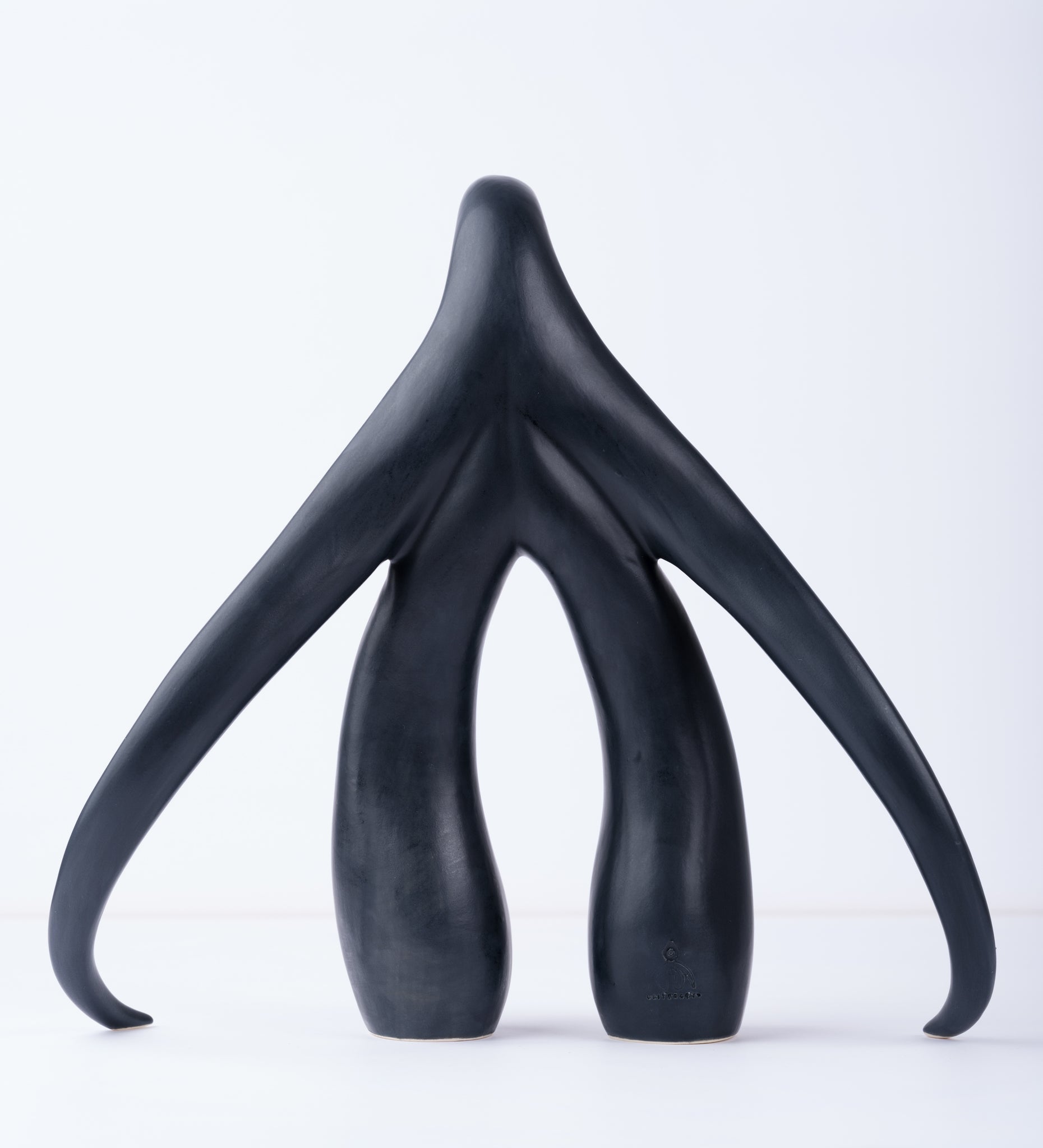 Back view of "Swan Series" ceramic sculpture in matte black by Sophia Wallace, 2022.