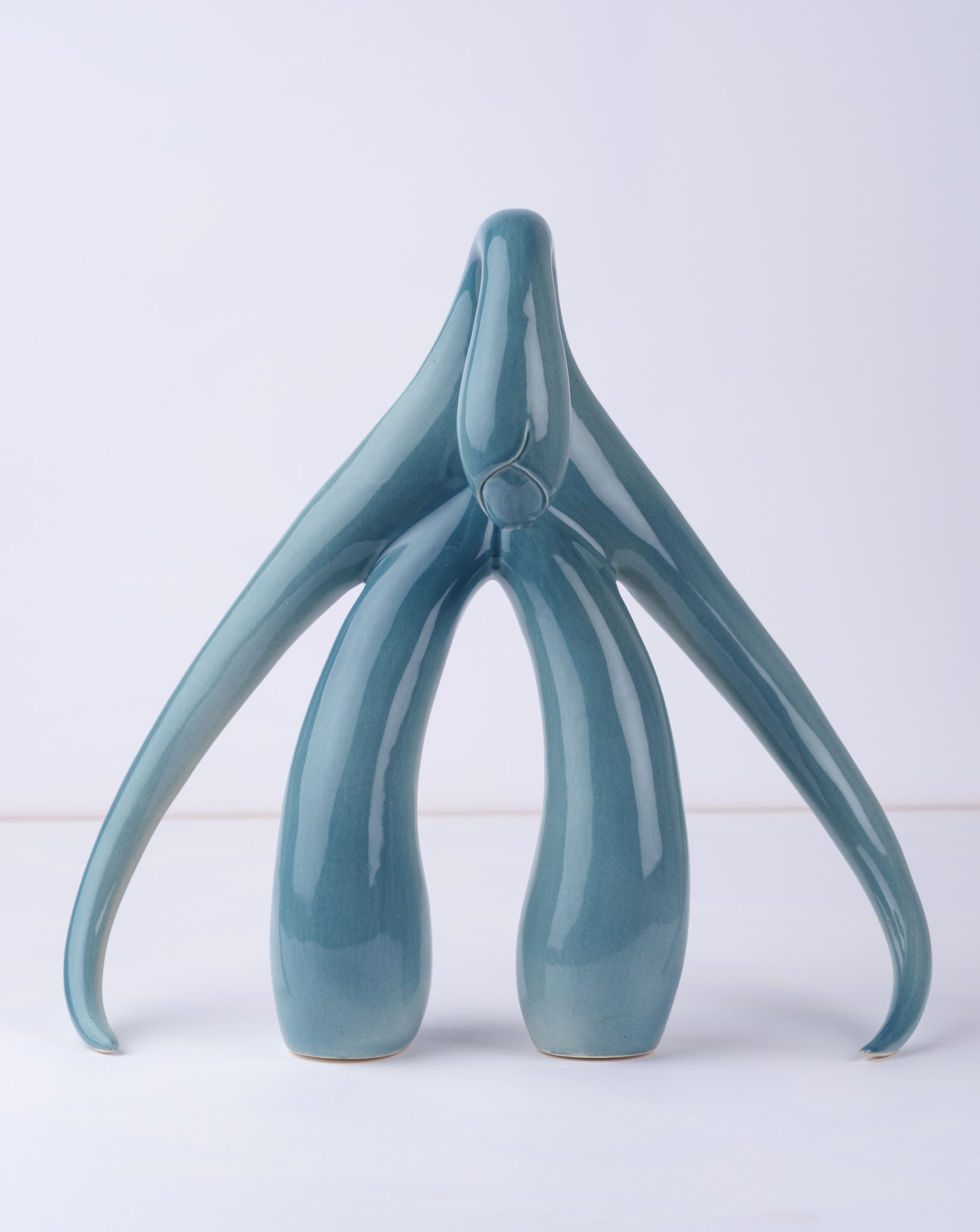 Front view of "Swan Series" ceramic sculpture in aqua by Sophia Wallace, 2022.f