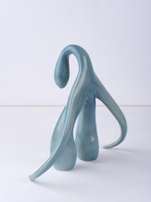 3/4 back view, high angle, of "Swan Series" ceramic sculpture in aqua by Sophia Wallace, 2022.