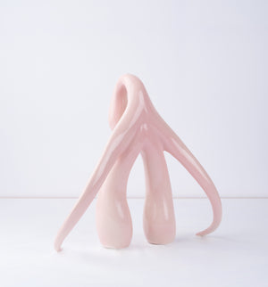 3/4 back view of "Swan Series" ceramic sculpture in light pink by Sophia Wallace, 2022.