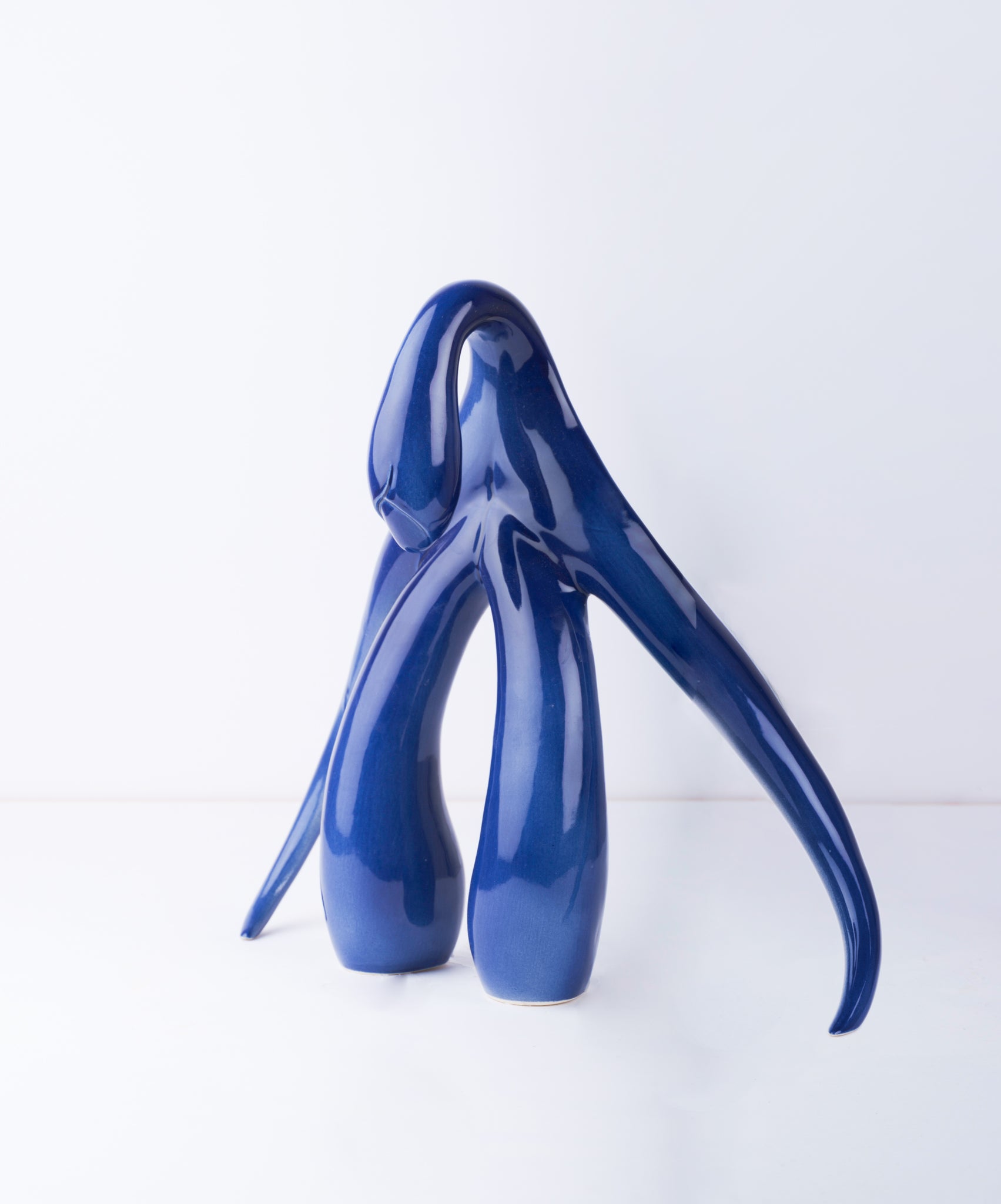 3/4 front view of "Swan Series" ceramic sculpture in cobalt by Sophia Wallace, 2022.