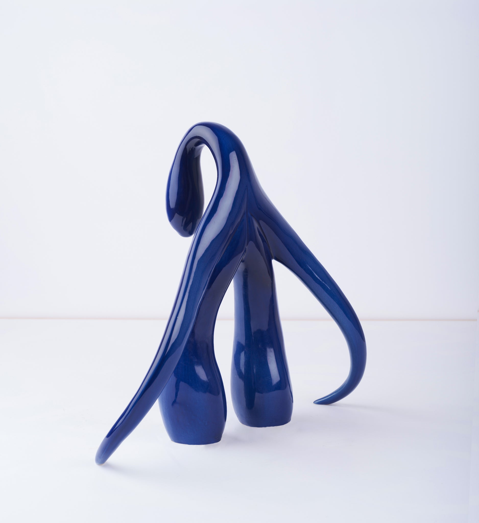 3/4 back view of "Swan Series" ceramic sculpture in cobalt by Sophia Wallace, 2022.